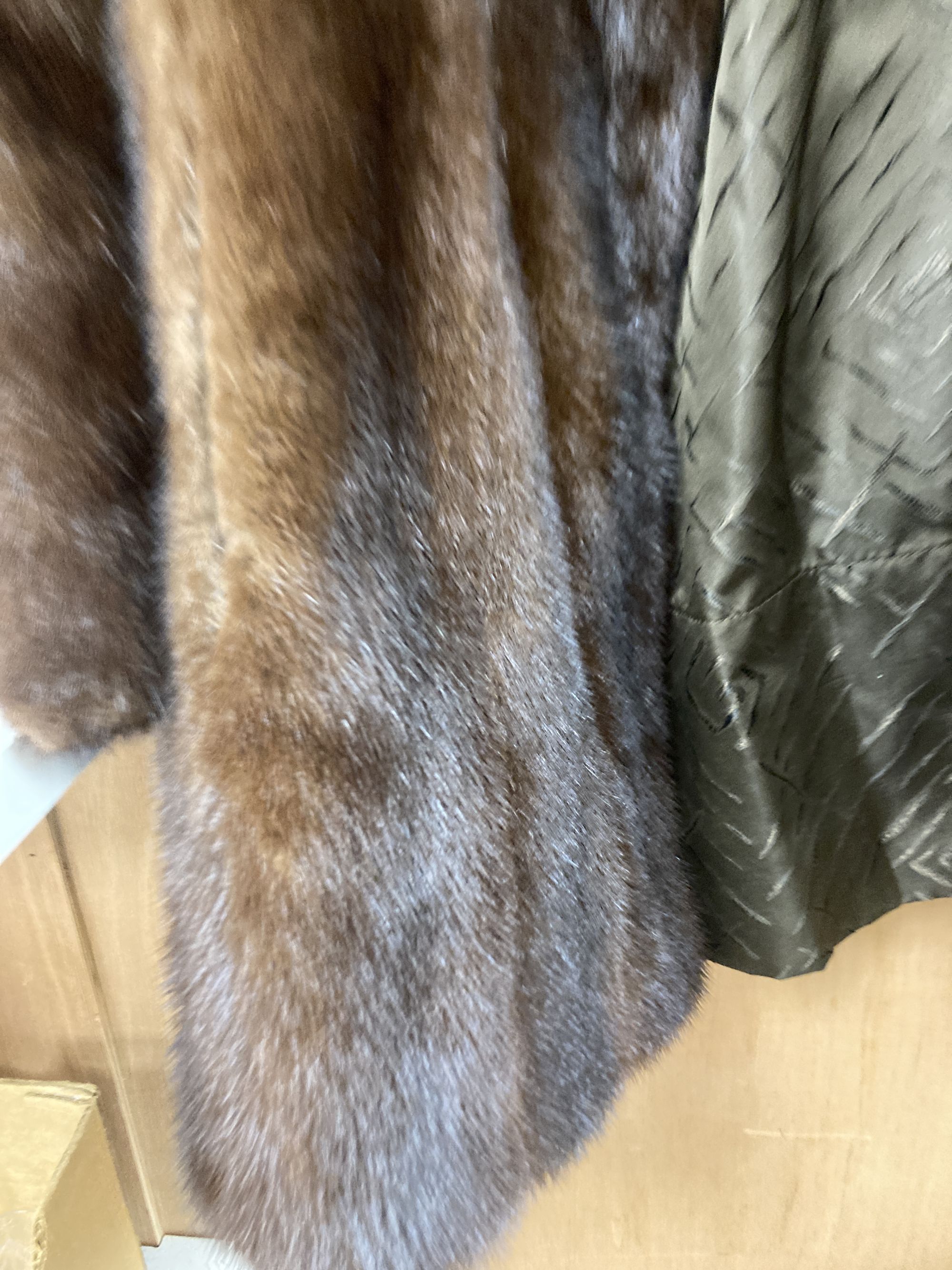 A brown mink fur coat, hat and ties
